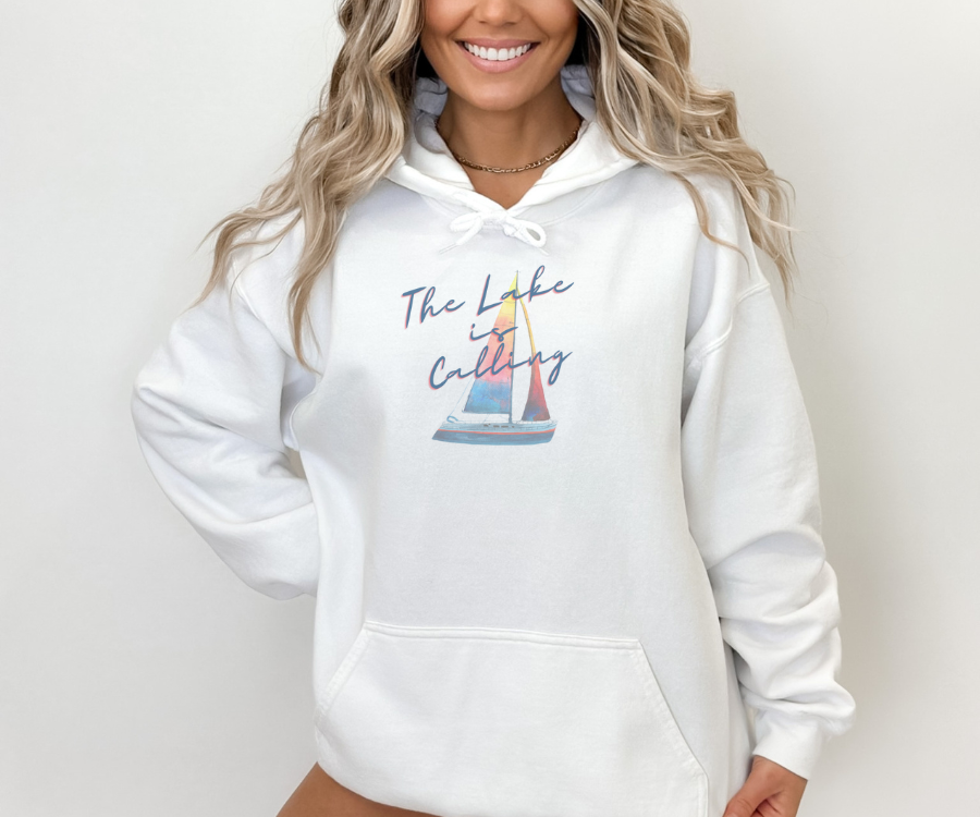 The Lake is Calling Colorful Sailboat Unisex Hoodie, lettering diagonally positioned over a colorful sailboat