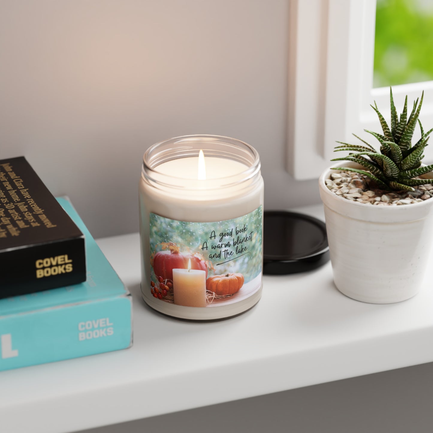 A good book, a warm blanket and the lake scented candle, 9oz, the perfect complement to autumn