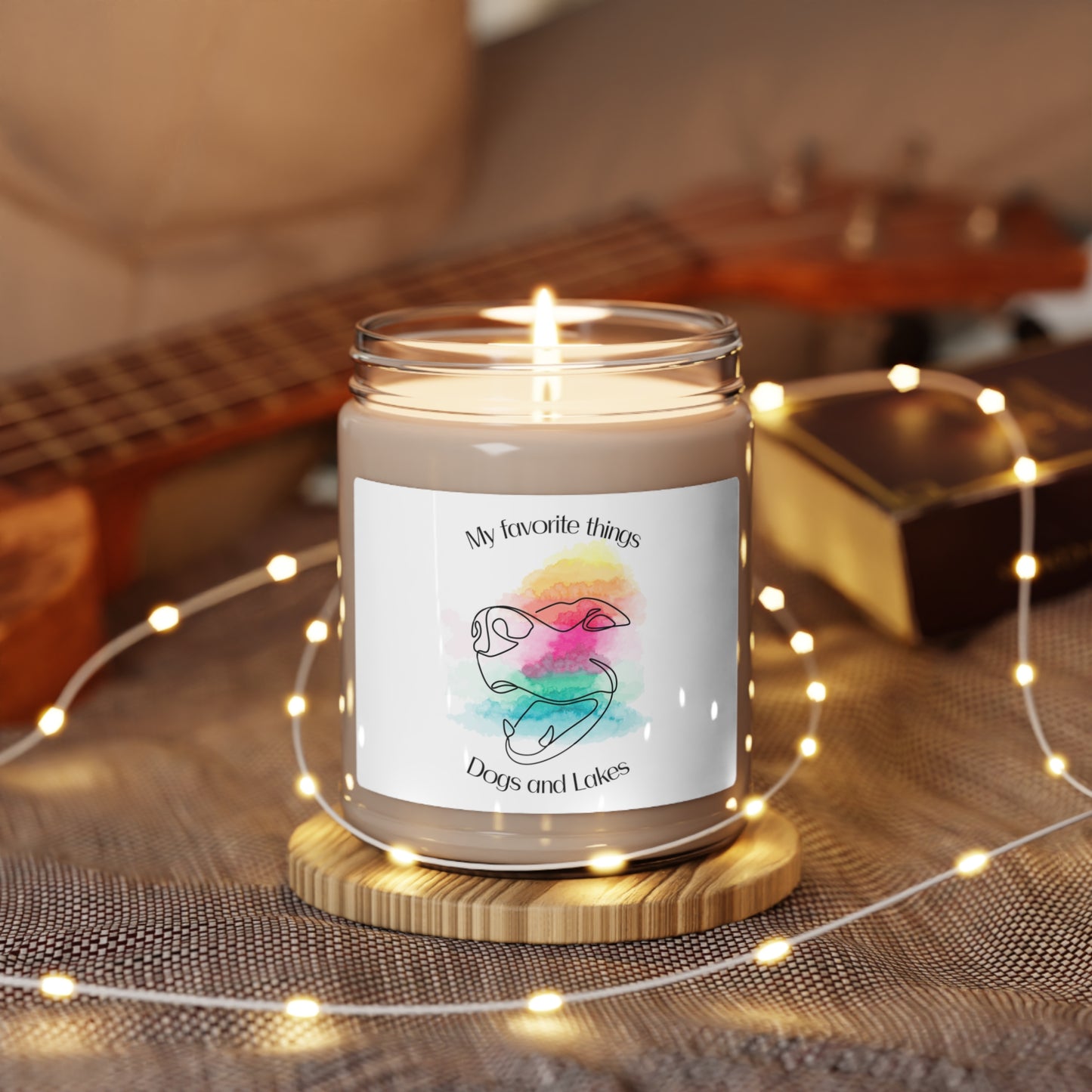 My Favorite Things ... Dogs and Lakes Scented Candle, 9oz, featuring a line drawing of a cute face face with multi-color watercolor background