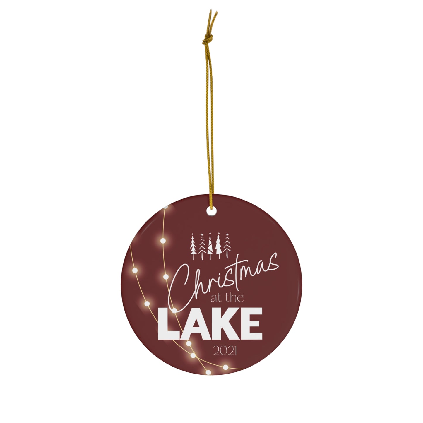 Christmas at the Lake 2021 Sparkling Lights Ceramic Ornament, elegant circle shaped tree ornament with a deep red colored background and white lettering