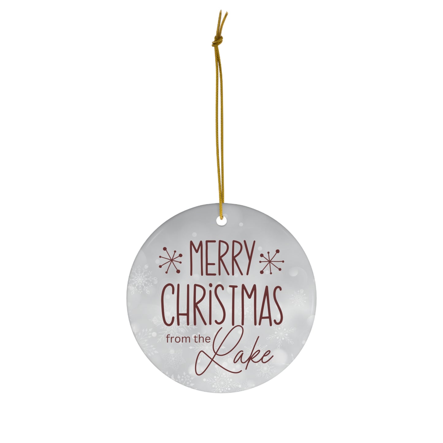 Merry Christmas from the Lake Ceramic Ornament, elegant circle shaped tree ornament with deep red colored farmhouse style lettering on a light grey snowflake background