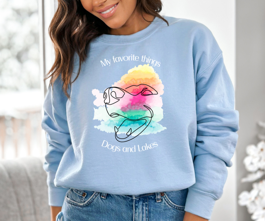 My Favorite Things ... Dogs and Lakes Unisex Sweatshirt, featuring a line drawing of a cute dog face on a multi-color watercolor back drop.