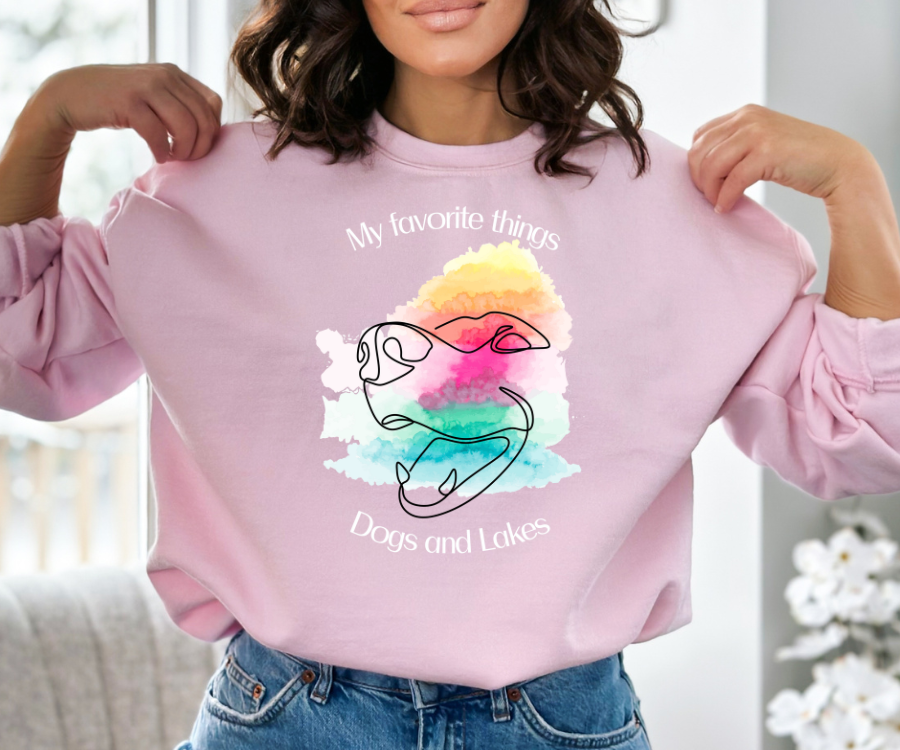 My Favorite Things ... Dogs and Lakes Unisex Sweatshirt, featuring a line drawing of a cute dog face on a multi-color watercolor back drop.