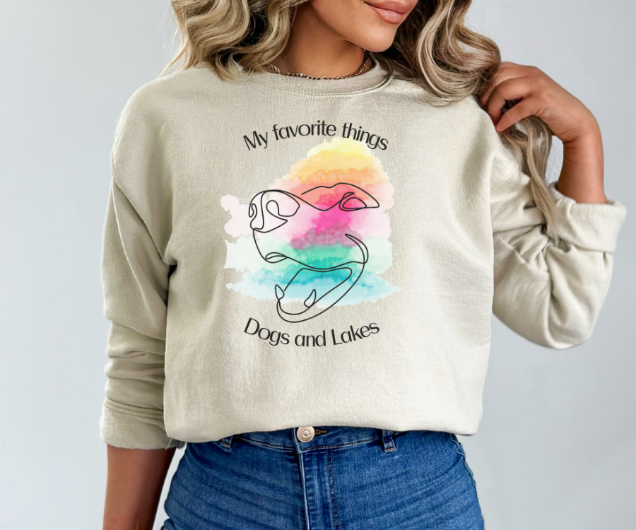 My Favorite Things ... Dogs and Lakes Unisex Sweatshirt, featuring a line drawing of a cute dog face on a multi-color watercolor back drop.