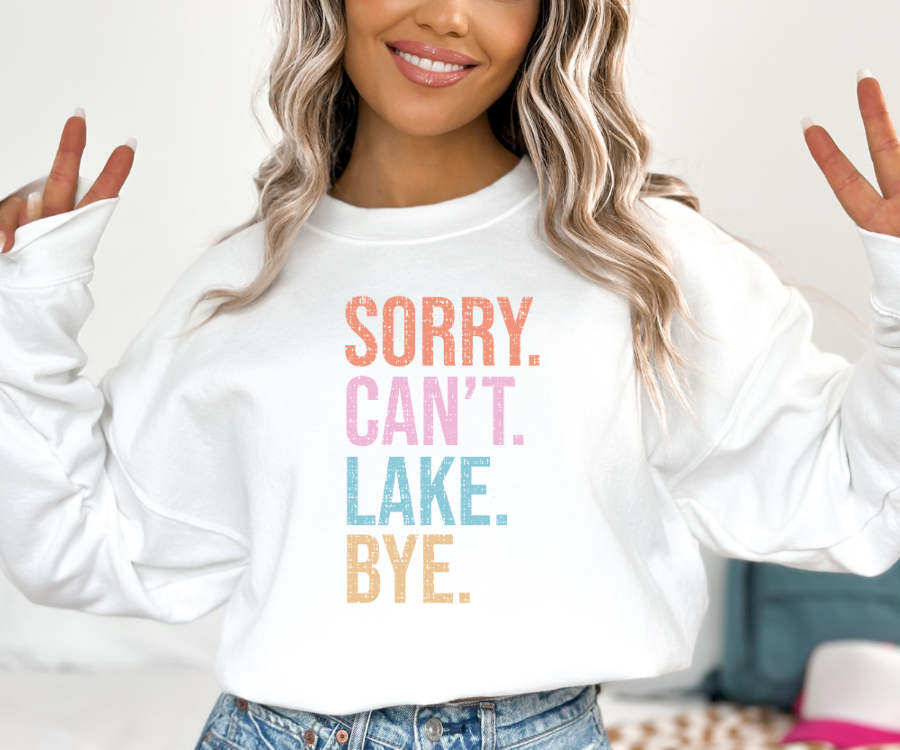 Sorry. Can't. Lake. Bye. White Sweatshirt featuring each word in a different color (muted orange, pink, turquoise, and yellow).