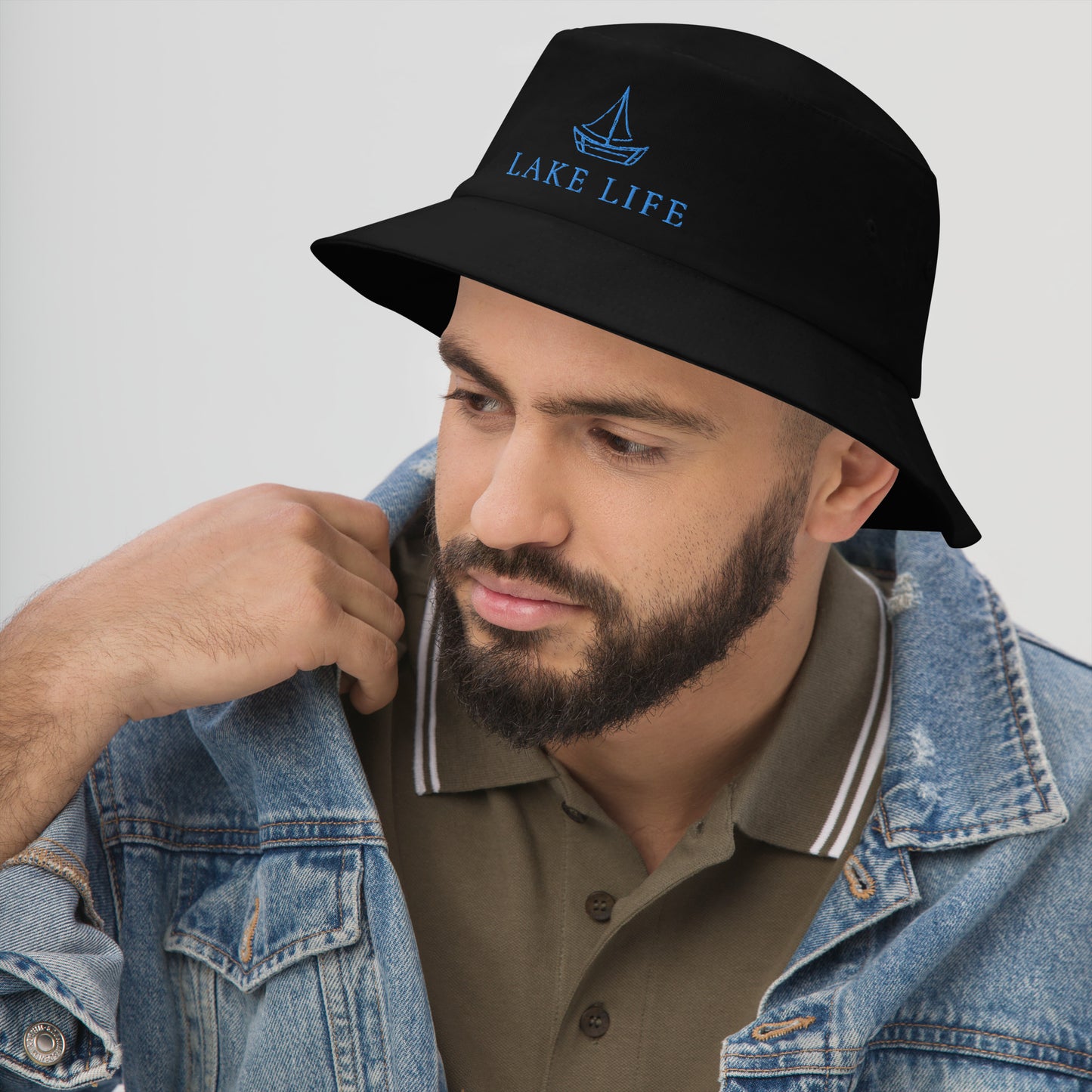 Lake Life Sailboat Bucket Hat, featuring a simple sailboat drawing in blue accompanied by the words Lake Life below the design