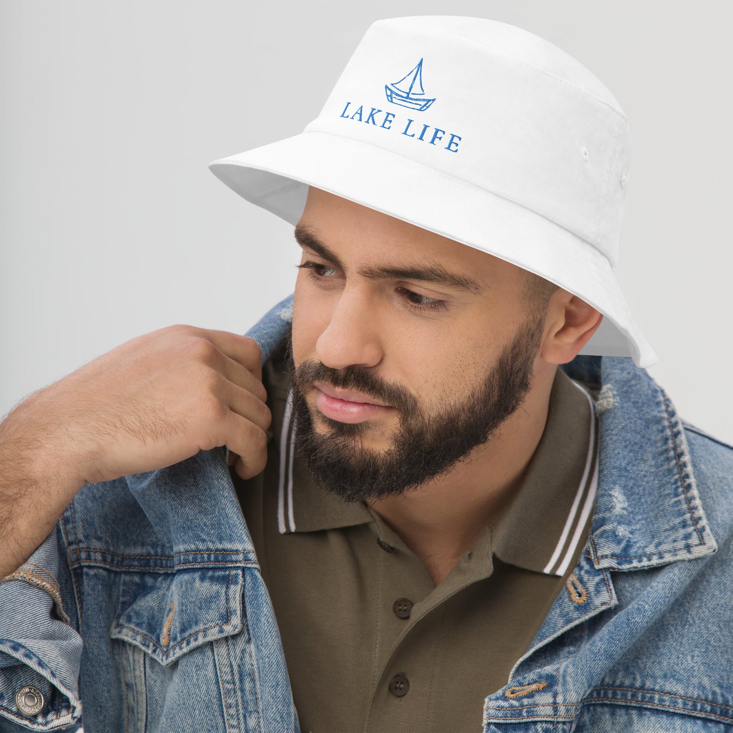 Lake Life Sailboat Bucket Hat, featuring a simple sailboat drawing in blue accompanied by the words Lake Life below the design