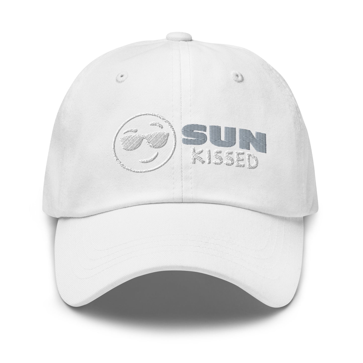 Sun Kissed Dad Hat, featuring an embroidered emoji face wearing sunglasses with grey and white lettering to the right of the design