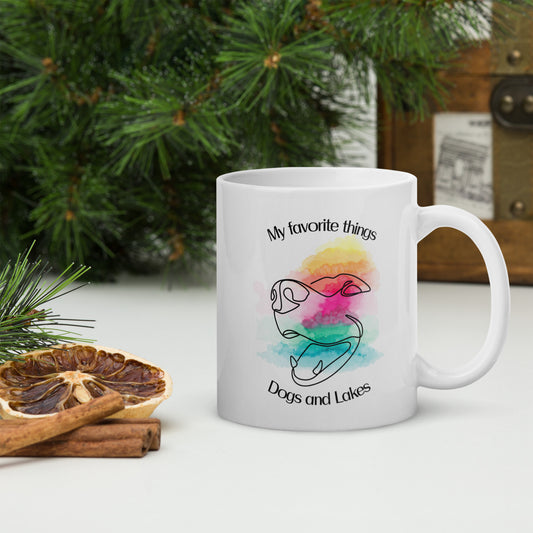 My favorite things ... Dogs and Lakes white glossy mug, if you love dogs and lakes then this mug is for you.  Featuring a line drawing of a cute dog face on multi-color watercolor back drop.