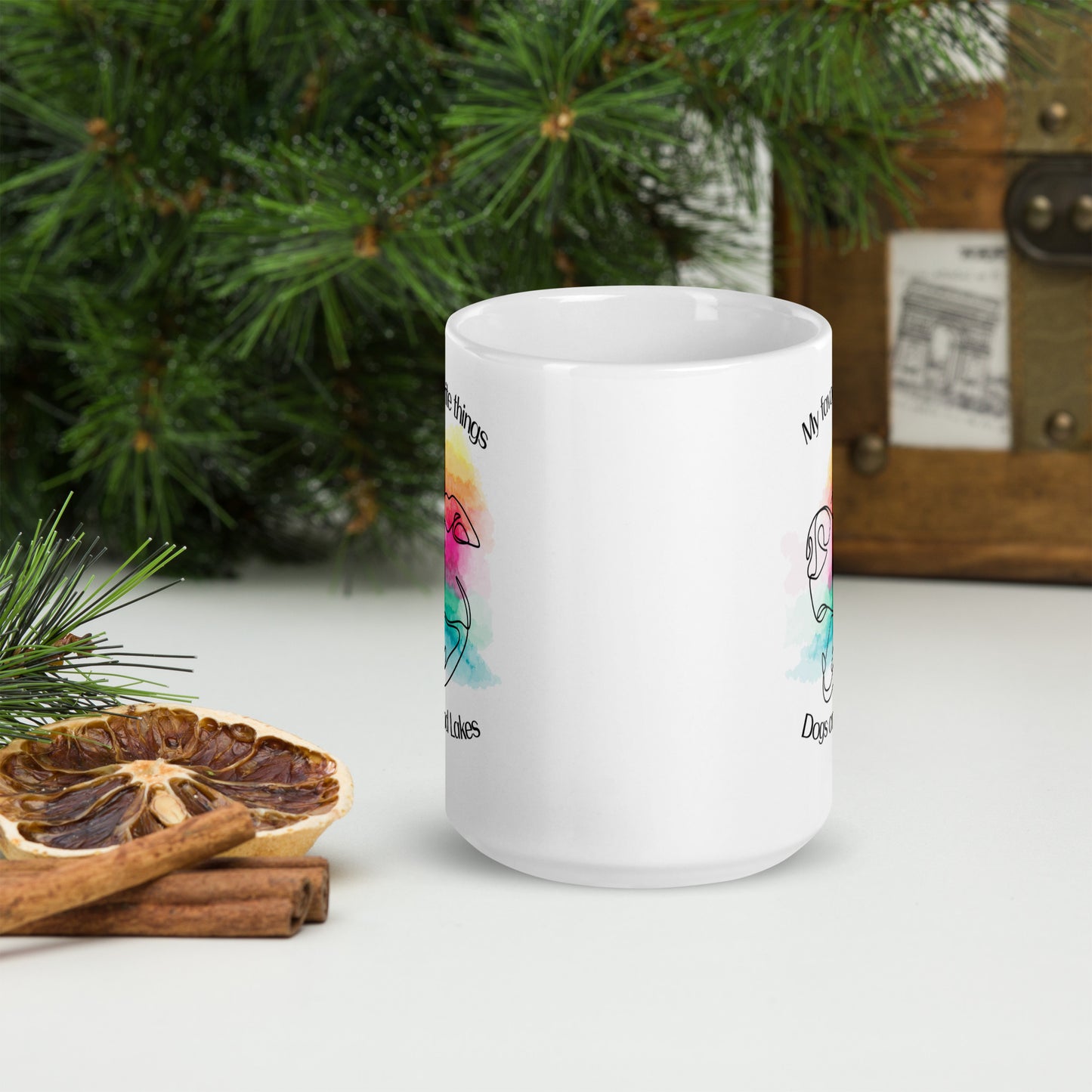 My favorite things ... Dogs and Lakes white glossy mug, if you love dogs and lakes then this mug is for you.  Featuring a line drawing of a cute dog face on multi-color watercolor back drop.